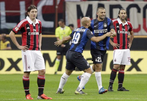 Inter Milan's Samuel celebrates with Cambiasso after scoring against AC Milan during their Italian Serie A soccer match in Milan