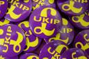 UKIP badges are seen as UK Independence Party supporters gather at their party conference in Doncaster on September 26, 2014