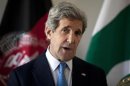 U.S. Secretary of State John Kerry delivers a statement after a meeting with Afghan President Hamid Karzai and Pakistani Army Chief General Ashfaq Parvez Kayani in Brussels
