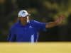 Angel Cabrera of Argentina waves as he walks onto the 18th green during third round play in the 2013 Masters golf tournament in Augusta