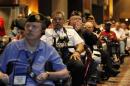 Disabled U.S. veterans listen to President Obama at the National Convention of Disabled American Veterans in Atlanta