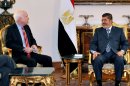 In this image released by the Egyptian Presidency, Egyptian President Mohammed Morsi, right, meets with Republican Sen. John McCain, at the Presidential Palace in Cairo, Egypt, Wednesday, Jan. 16, 2013. Morsi met with McCain in Cairo on Wednesday, for a visit expected to last three days. The meeting comes after the Obama administration on Tuesday gave a blistering review of remarks that the Egyptian President made almost three years ago about Jews and called for him to repudiate what it called unacceptable rhetoric. (AP Photo/Egyptian Presidency)