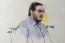 James Holmes sits in Arapahoe County District Court in Denver