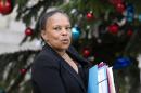 FILE - In this Jan.13, 2016 file photo, French Justice Minister Christiane Taubira walks out after the weekly cabinet meeting at the Elysee Palace, in Paris. Taubira has resigned Wednesday, Jan.27, 2016 after objecting to the president's push to revoke citizenship from convicted terrorists with dual nationality.(AP Photo/Jacques Brinon, File)