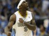 Denver Nuggets guard Ty Lawson celebrates hitting a three-point basket against the Los Angeles Lakers in Denver