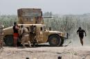 Iraqi security forces clash with Islamic State militants near Falluja