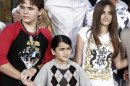 FILE - This Jan. 26, 2012 file photo shows, from left, Prince Jackson, Blanket Jackson and Paris Jackson after a hand and footprint ceremony honoring their father musician Michael Jackson in front of Grauman's Chinese Theatre in Los Angeles. The executors of Michael Jackson's estate say they are concerned about the welfare of the singer's mother and his three children. In a letter posted on fan sites Tuesday, July 24, executors John Branca and John McClain says they are doing what they can to protect them from “undue influences, bullying, greed, and other unfortunate circumstances.” The letter came hours after sheriff's deputies responded for a family disturbance at the hilltop home where Katherine Jackson and her three grandchildren live. No arrests were made, but there is an active battery investigation. Katherine Jackson was reported missing over the weekend, but is with relatives in Arizona. (AP Photo/Matt Sayles)