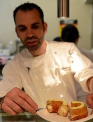 French pastry chef Dominique Ansel presents one of his cronuts, at his bakery shop in New York, on June 14, 2013. Ansel settled upon the idea of the cronut after deciding he wanted to create a hybrid pastry that would be instantly recognizable as a marriage of French and American food cultures