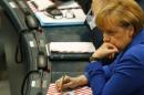 German Chancellor Merkel waits for start of constitutional meeting of Bundestag in Berlin
