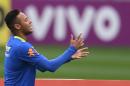 Brazilian Olympic football team player Neymar gestures during a training session ahead of the Rio 2016 Olympic Games at the Granja Comary sport complex in Teresopolis, about 90 km from Rio de Janeiro, Brazil, on July 22, 2016