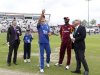 England captain Alastair Cook throws the coin atn the toss watched by West Indies captain Darren Sammy