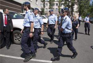 Dutch policemen walk in the city of Donetsk, eastern &hellip;