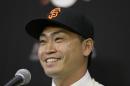 San Francisco Giants outfielder Nori Aoki, of Japan, smiles after being introduced at a baseball news conference at AT&T Park Tuesday, Jan. 20, 2015, in San Francisco. The 33-year-old from Japan receives a $4 million base salary this year, and the Giants have a $5.5 million option for 2016 with a $700,000 buyout. Aoki played last season with Kansas City, which lost the World Series to the Giants in seven games. (AP Photo/Eric Risberg)