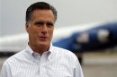 Republican presidential candidate and former Massachusetts Governor Mitt Romney talks to reporters at the airport in Sergeant Bluff
