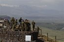 Israeli soldiers receive a briefing in the Israeli-occupied Golan Heights