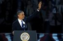 U.S. President Barack Obama, who won a second term in office by defeating Republican presidential nominee Mitt Romney, waves before addressing supporters during his election night victory rally in Chicago