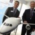 Boeing company's chairman and CEO, McNerney and Conner, President and CEO of Boeing commercial airplanes, pose with a 787-10 model during the 50th Paris Air Show, at the Le Bourget airport