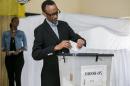 Rwandan President Paul Kagame casts his ballot in the capital Kigali on December 18, 2015 in a referendum to amend the constitution allowing him to rule until 2034