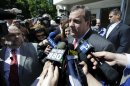 New Jersey Gov. Chris Christie talks to the press after casting his primary election vote, Tuesday, June 4, 2013, in Mendham Township, N.J. (AP Photo/Julio Cortez)