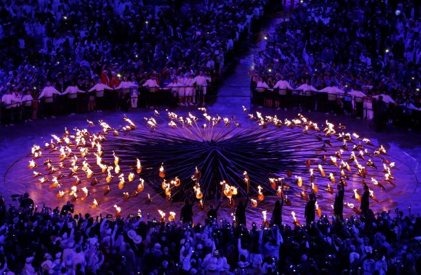 The stems forming the Olympic Cauldron are lit by seven young athletes during the opening ceremony of the London 2012 Olympic Games at the Olympic Stadium