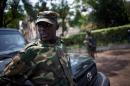 The head of the M23 rebel military forces, Brigadier-General Sultani Makenga, leans on a car on November 25, 2012 on the grounds of a military residence in Goma