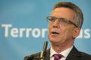 German Interior Minister Thomas de Maiziere speaks during the opening of the joint counter terrorism center in Berlin Thursday, Oct. 2, 2014. Germany's top security official said Thursday that Europe's system of passport-free travel needs to be changed to prevent Islamic extremists crossing borders undetected. (AP Photo/dpa, Tim Brakemeier)