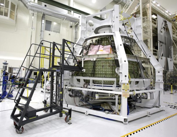 FILE - In this Jan. 13, 2013 file photo, the Orion Exploration Flight Test 1crew module is seen in the Operations and Checkout building during a media tour at the Kennedy Space Center in Cape Canaveral, Fla. Senate Science and Space subcommittee Chairman Sen. Bill Nelson, D-Fla. says President Barack Obama and NASA are planning for a robotic spaceship to lasso a small asteroid and park it near the moon. Then astronauts would explore it in 2021. Nelson said the plan would speed up by four years an existing mission to land astronauts on an asteroid by bringing the space rock closer to Earth. (AP Photo/John Raoux)