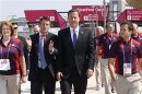 Britain's PM David Cameron walks with Chairman of the Olympic Organising Committee Sebastian Coe at the Olympic Park in Stratford