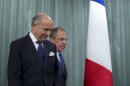 French Foreign Minister Laurent Fabius, left, and his Russian counterpart Sergey Lavrov arrive for a news conference after their meeting in Moscow, Russia, on Tuesday, Sept. 17, 2013. Moscow is insisting that a new United Nations resolution on Syria not allow the use of force, but Russia's foreign minister appears to suggest the issue could be reconsidered if Syria violates an agreement on abandoning its chemical weapons. (AP Photo/Ivan Sekretarev)