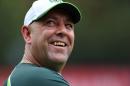 Australia's cricket team coach Darren Lehmann smiles during a net practice session at the Melbourne Cricket Ground on February 13, 2015