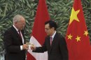 Chinese Commerce Minister Gao toasts with Swiss Economy Minister Schneider-Ammann after signing a free-trade agreement in Beijing