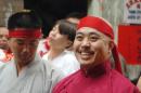 FILE - In this Aug. 6, 2006 file photo, Raymond "Shrimp Boy" Chow smiles after being sworn in as the "Dragon Head" of the Chee Kung Tong in Chinatown in San Francisco. Chow, a central figure in a sweeping San Francisco organized crime and public corruption case, pleaded not guilty. The FBI spent many millions of dollars and used more than a dozen undercover operatives posing as honest businessmen and Mafia figures alike during its seven year organized crime investigation centered in San Francisco's Chinatown. Now, an increasing number of the defendants caught up in the probe that has ensnared a state senator and an aide are arguing that the FBI and its undercover agents are guilty of entrapment, luring otherwise honest people to go along with criminal schemes hatched by federal officials. (AP Photo/Sing Tao Daily, File)