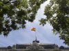 A Spanish flag flies over the Bank of Spain in Madrid
