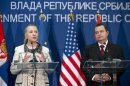 U.S. Secretary of State Hillary Clinton speaks next to Serbian Prime Minister Ivica Dacic during a news conference following meetings at the Palace of Serbia in Belgrade
