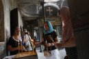 Russian Orthodox worshippers light candles at St. Elijah Church in Istanbul
