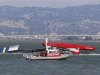 The Artemis Racing yacht is towed to shore after capsizing in the San Francisco Bay