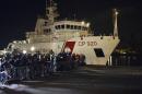 Italian Coast Guard ship Bruno Gregoretti, carrying survivors of the boat that overturned off the coasts of Libya Saturday, arrives at Catania Harbor, Italy, Monday, April 20, 2015. A smuggler's boat crammed with hundreds of people overturned off Libya's coast as rescuers approached, causing what could be the Mediterranean's deadliest known migrant tragedy and intensifying pressure on the European Union Sunday to finally meet demands for decisive action. (AP Photo/Carmelo Imbesi )
