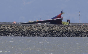 The tail of Asiana Flight 214, which crashed on Saturday, …
