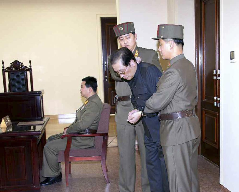 Jang Song Thaek is dragged into the court by uniformed personnel