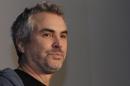 FILE - In this Oct. 16, 2013 file photo, Mexican filmmaker Alfonso Cuaron poses for photographers during a press conference promoting his film "Gravity" in Mexico City. Despite feeble cries of 