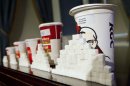 File photo of a 64-ounce drink displayed alongside other soft drink cup sizes at a news conference at City Hall in New York