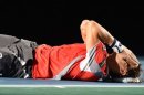 El tenista español David Ferrer se lleva las manos a la cara tras vencer al polaco Jerzy Janowicz este domingo