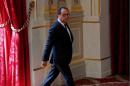 French President Francois Hollande arrives to deliver a statement after a defence council at the Elysee Palace in Paris