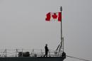 A member of the Canadian Armed Forces stands onboard a ship docked in Constanta, Romania on March 13, 2015