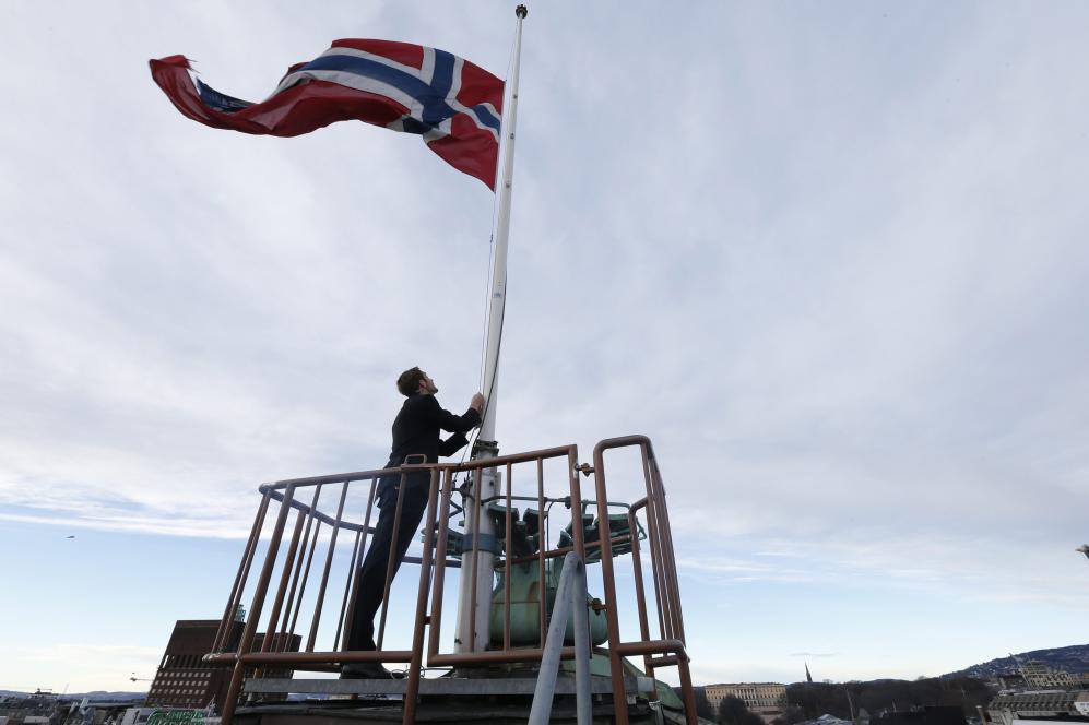 The Norwegian flag flies at half-mast as a mark of respect following the death of former South African President Mandela, at the Houses of Parliament in Oslo