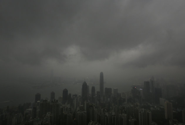 Dark clouds hang low over Hong Kong's Victoria Habour Sunday, Sept. 22, 2013. Usagi, the year's most powerful typhoon had Hong Kong in its cross-hair on Sunday after sweeping past the Philippines and Taiwan and pummeling island communities with heavy rains and fierce winds. The typhoon was grinding westward and expected to make landfall close to Hong Kong late Sunday or early Monday. (AP Photo/Vincent Yu)