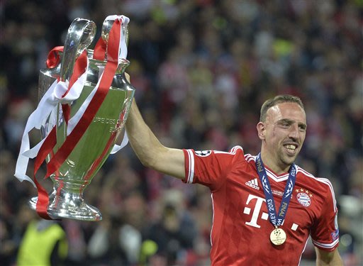 Bayern Munich's Franck Ribery of France lifts the trophy after winning the Champions League Final soccer match against Borussia Dortmund at Wembley Stadium in London, Saturday May 25, 2013