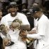 The Miami Heat's Dwyane Wade, right, holds the Larry O'Brien NBA Championship Trophy as LeBron James holds his Bill Russell NBA Finals Most Valuable Player Award after Game 7 of the NBA basketball championship game against the San Antonio Spurs, Friday, June 21, 2013, in Miami. The Miami Heat defeated the San Antonio Spurs 95-88 to win their second straight NBA championship. (AP Photo/Lynne Sladky)