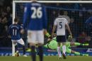 Everton's Kevin Mirallas, left, misses a penalty as West Bromwich Albion's goalkeeper Ben Foster dives in an attempt to save it during the English Premier League soccer match between Everton and West Bromwich Albion at Goodison Park Stadium, Liverpool, England, Monday Jan. 19, 2015. (AP Photo/Jon Super)