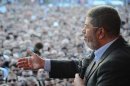Egypt's President Mohamed Mursi speaks to supporters in front of the presidential palace in Cairo